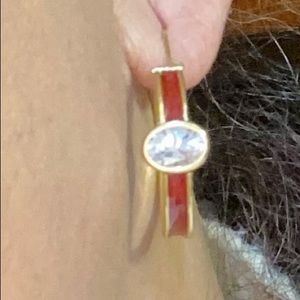 18k yellow gold with enamel coating and CZ stones.